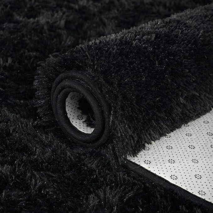 Dark area rug for a defined seating zone