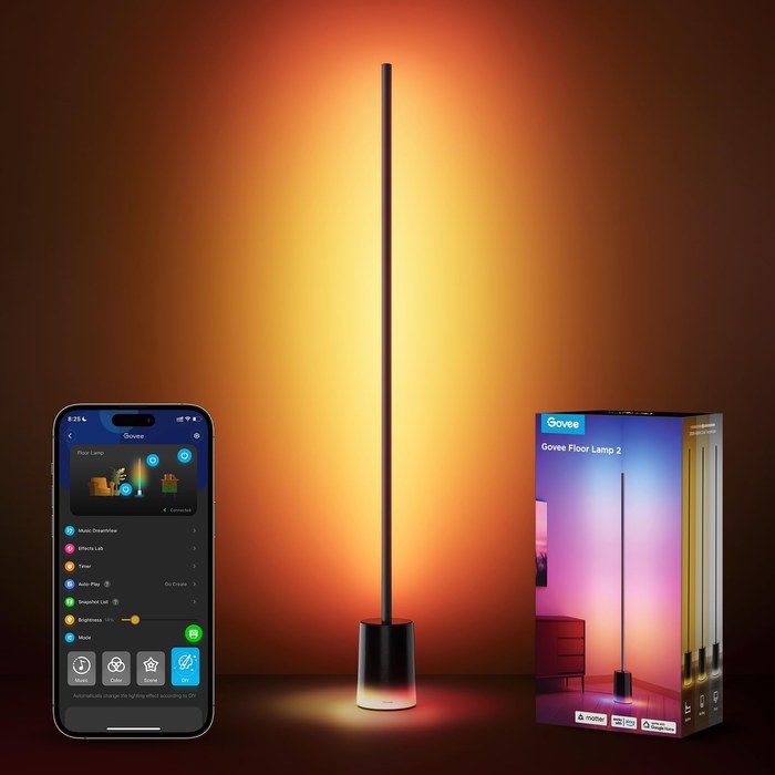 Actual black Govee Floor Lamp 2 H607C with illuminated base, pictured beside its app and box