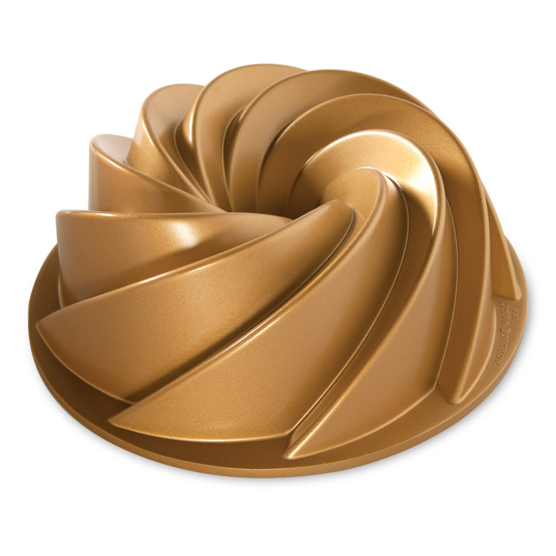 Official product photograph of the Gold Nordic Ware Heritage Bundt Pan showing its sculpted spiral shape.